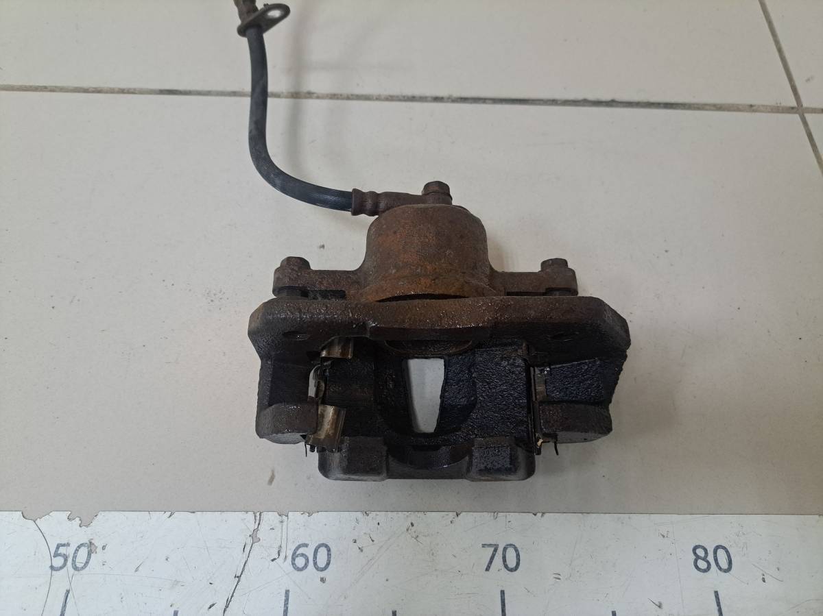 Суппорт передний левый Toyota Vitz P90 2005-2011